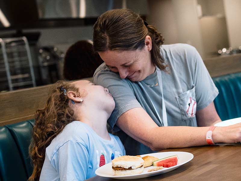 Mother and daughter enjoy a meal